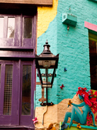 A colorful wall and streetlamp in London's West End
